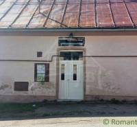 A shabby family house with a tin roof and white doors, Romantic cottages.