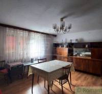 The interior of a room with furniture and a table that decorates a family house.