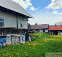 A country cottage with a flower meadow, ideal for unique properties and living.