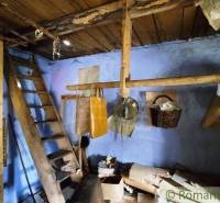 An old wooden ladder in a room with historical equipment. Peculiar properties.