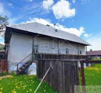 A historic house with a gabled roof and wooden fencing in a Special property.
