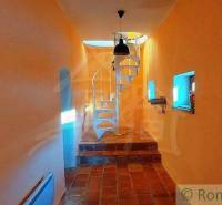 Brick floor, spiral staircase, and unique properties create unique architectural features.