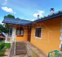 A family house surrounded by green hills, interesting properties in a natural environment, cottages.