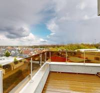 View from the terrace of a 4-room apartment on Brezová Street in Malacky with a changing sky.