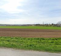 Vast fields and greenery in the background with urban buildings in Nitra suitable for commercial land.