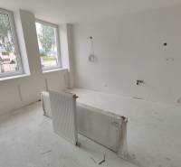 A bright room in a 3-room apartment with renovations and large windows.