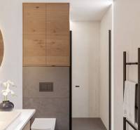 Bathroom in a holiday apartment with wooden cabinets, shower, and toilet.