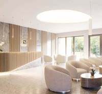 Stylish interior of a Holiday Apartment with modern white armchairs and a designer reception.