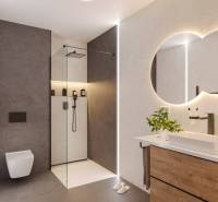 Bathroom in a holiday apartment with a shower, sink, and wooden cabinet.