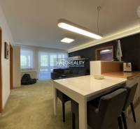 Space in a 3-room apartment with a dining room and living room, light walls, wooden accents.