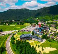 Aerial view of Donovaly with surrounding mountains and 3-bedroom apartments.