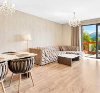 Living room in a 3-room apartment with an elegant table and sofa.