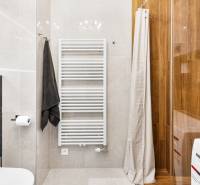 A bathroom in a 3-room apartment with modern equipment and wooden paneling.