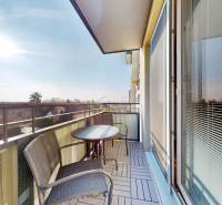 The balcony of a 3-room apartment on Kazanská Street in Bratislava-Vrakuňa with a view of the surroundings.