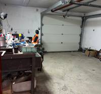 Garage in a family house with a workbench and tools.