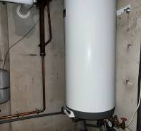 Boiler and pipes in the basement of a family house.