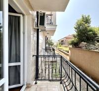 A balcony in a holiday apartment in Nessebar with a view of the green surroundings.