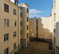 A courtyard surrounded by residential buildings on Vodná Street in Košice - Staré Mesto district.