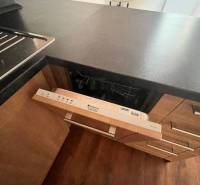 A kitchen unit with a built-in dishwasher in a 3-room apartment.