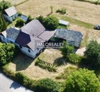 A family house in Ploské surrounded by nature and accessible via a road.