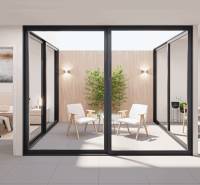 A glazed terrace with furniture on the ground floor of a family house, an open space for relaxation.