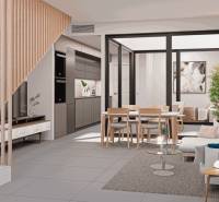 Interior of a family house with a kitchen, dining area, staircase, and comfortable seating.