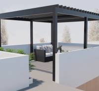A pergola on the terrace of a family house in San Pedro del Pinatar with plants and comfortable seating.