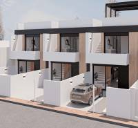 A family house in San Pedro del Pinatar with a white facade and parking spaces for cars.