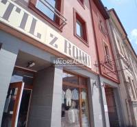 Commercial premises in Brezno with a stylish display window, brick facade, glass doors.