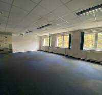 Empty office with carpeted floor and large windows in the building Warehouses and Halls.