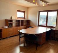 Office room with wooden furniture, windows, and ceiling lighting. Warehouses and halls.