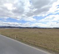 Wide flat landscape near Sučany, ideal for commercial land use.
