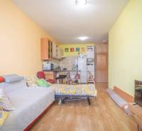 Bright room with a chair, bed, and window in a 3-room apartment.