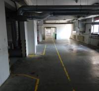 Industrial hall with ventilation pipes and floor markings in the production area.