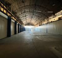 Spacious interior with an arched roof, suitable for warehouses and halls.