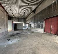 Interiors of warehouses and halls with iron roofs and concrete floors.