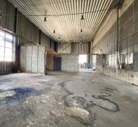Industrial interior of warehouses and halls with high ceilings and metal panels.