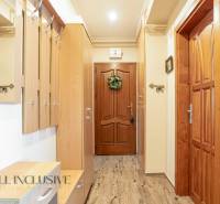 Wooden interior and coat rack wall in the hallway of a 2-room apartment.