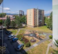 View from a 3-room apartment on Levočská Street in Poprad with a playground and parking.