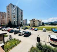 A view of the parking lot and residential buildings in Spišská Nová Ves on Hutnícka Street.
