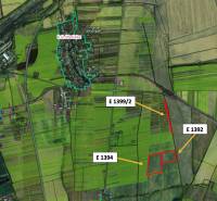 Aerial view of agricultural and forest land near Haniska, with marked parcels.