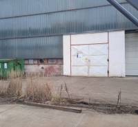 Industrial building with a slope and a container in Nové Mesto nad Váhom, warehouses and halls.