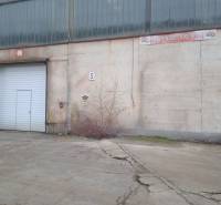 Old building and warehouse with industrial doors in Nové Mesto nad Váhom.