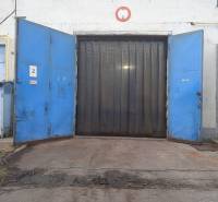 Open blue gates of the warehouse and hall in Nové Mesto nad Váhom.