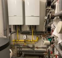 Gas boilers and pipes in the technical room of offices.