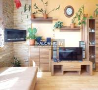 Living room with wooden furniture and decorations, suitable for a three-room apartment.
