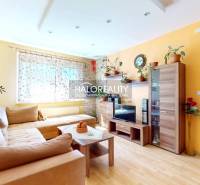 Living room in a 3-room apartment with light furniture, a sofa, and decorations.