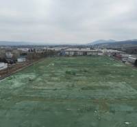 Commercial land area in Dubnica nad Váhom with adjacent industrial buildings.