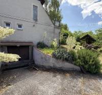 The exterior of the cottage in Radvaň nad Dunajom with a garden, gazebo, and garage.