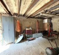 Stone interior with work tools and an iron ceiling in the cabin.